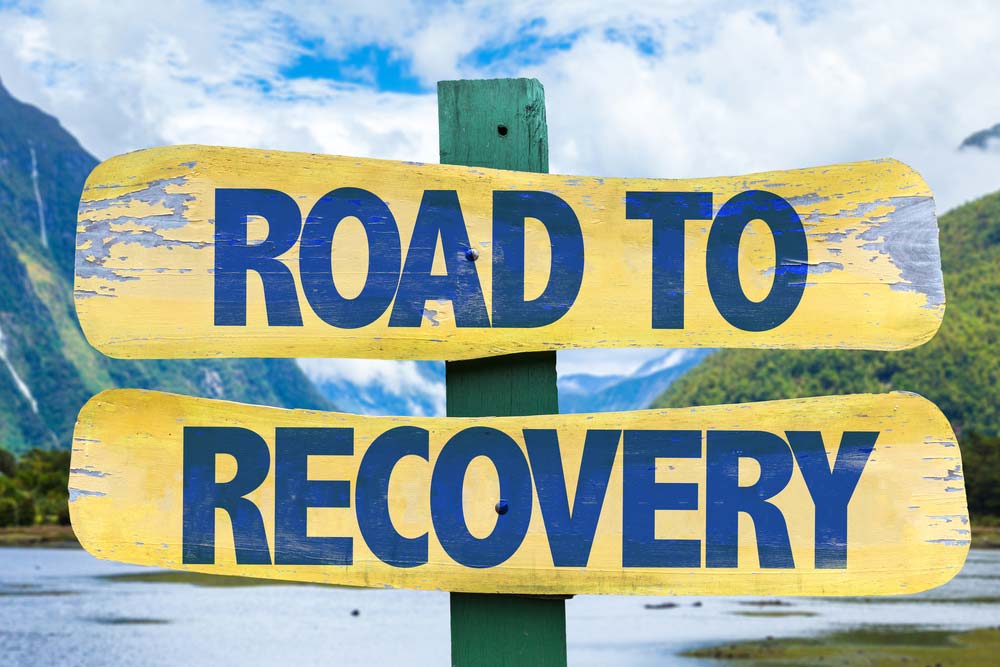 sign reading road to recovery - how to support a recovering addict - Fair Oaks Recovery Center - sacramento california drug addiction treatment rehab center