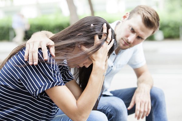 how to support an addict who has relapsed - man consoling woman - Fair Oaks Recovery Center