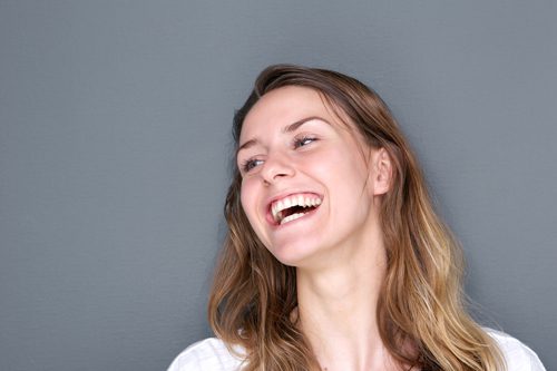 Humor-Based Therapy - young woman laughing